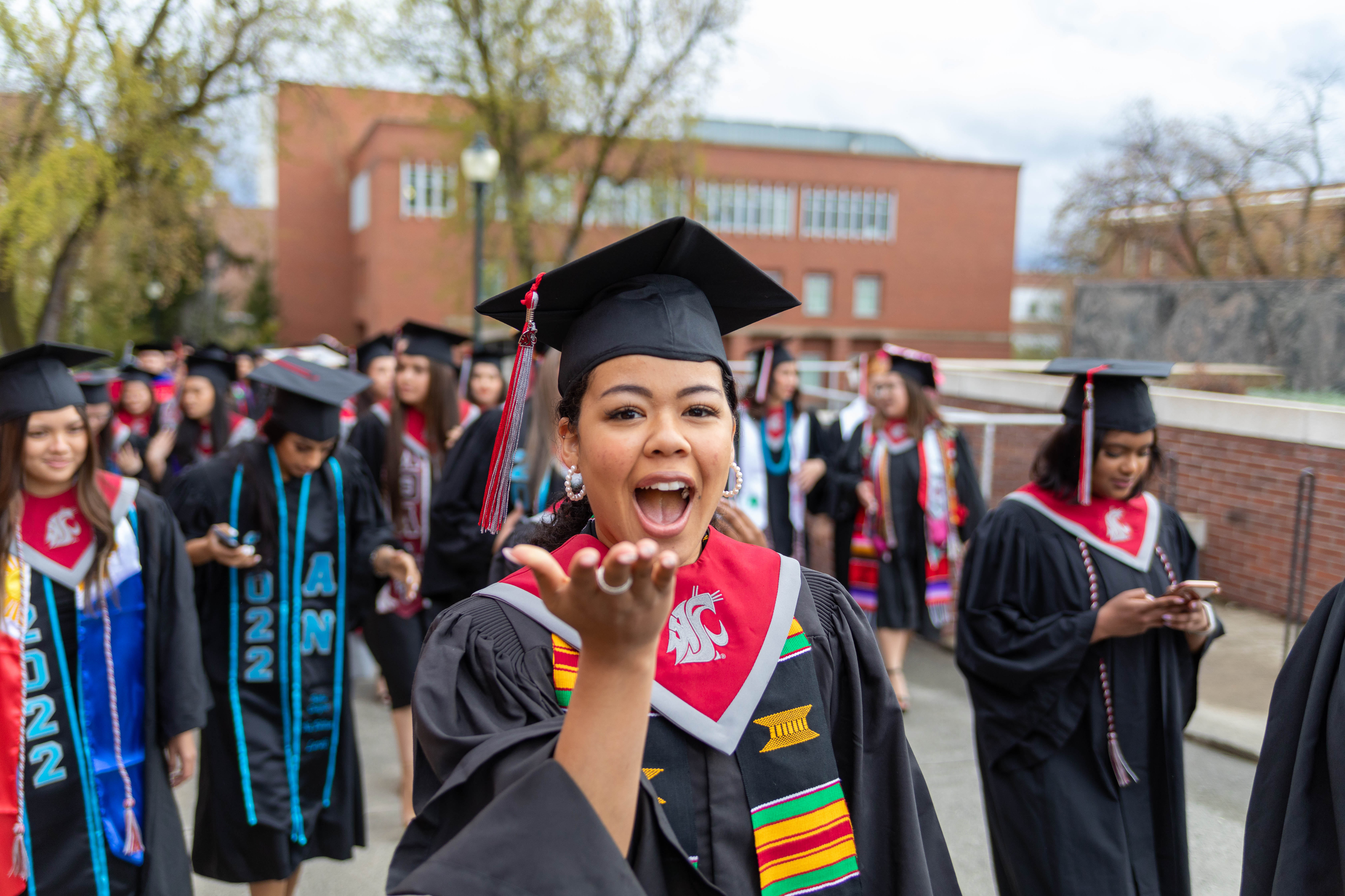 student in graduation regalia